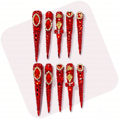 Ruby Royale – Crimson Red Long Stiletto Press-Ons with Rhinestone Halo, Heart Gem & Gold Bow Charms