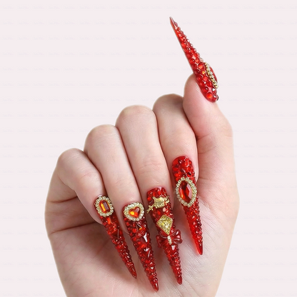 Ruby Royale – Crimson Red Long Stiletto Press-Ons with Rhinestone Halo, Heart Gem & Gold Bow Charms