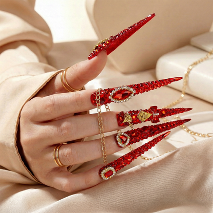 Ruby Royale – Crimson Red Long Stiletto Press-Ons with Rhinestone Halo, Heart Gem & Gold Bow Charms