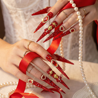 Ruby Royale – Crimson Red Long Stiletto Press-Ons with Rhinestone Halo, Heart Gem & Gold Bow Charms